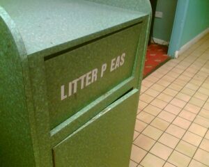 A photo of a rubbish bin at the now-demolished Bolton West Services on the M61. It says 'Litter P eas'.
