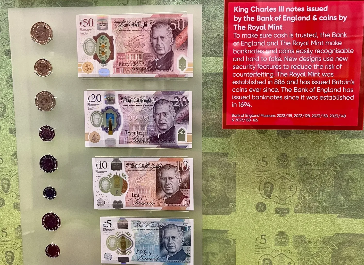 A photo of the new King Charles coins and bank notes at the Bank of England Museum in London