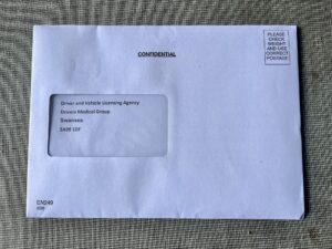 A photo of an envelope addressed to the medical team at the DVLA. My surrendered driving license is inside.